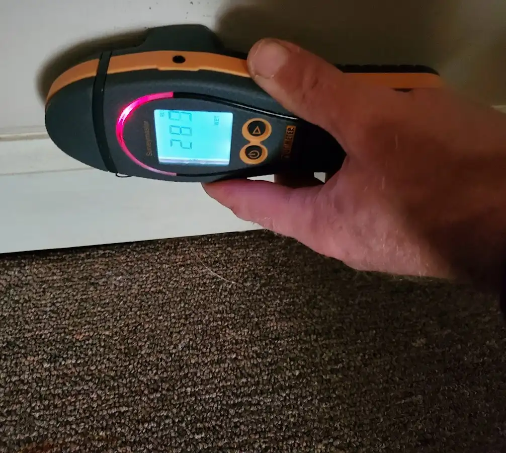 Moisture detection at baseboard during Storm Damage Restoration in Blytheville